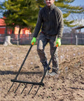 Man using Broad Fork Garden Tool With Ergonomic Design For Farms And Home Gardens, Easy Soil Turning And Weeding, 5 Tine Hand Cultivator