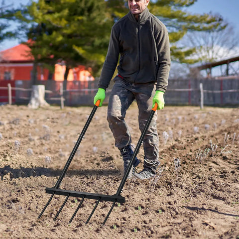 Man using Broad Fork Garden Tool With Ergonomic Design For Farms And Home Gardens, Easy Soil Turning And Weeding, 5 Tine Hand Cultivator