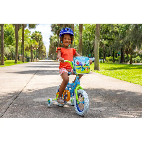 Child riding Bluey Themed 12 Inch Girls BMX Bike With Coaster Brake, Steel Frame, Training Wheels, Colorful Decals And Bar Pad