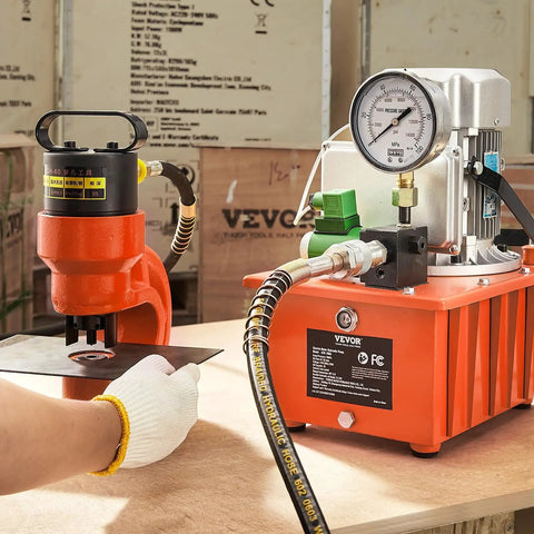Beefy 10,000 PSI 750W 110V Electric Hydraulic Pump Power Pack with 8 L capacity and dual 9.8 ft oil lines, orange unit in use