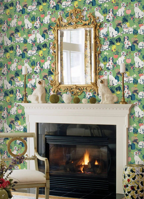 Interior with Jade Good Dog Peel And Stick Wallpaper By Printfresh Collab showing ceramic dog statues, green garden scene, and mirror.