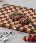 Real Deal Acacia Wood Checkered Cutting Board With Deep Juice Grooves And Solid Handles Large 17 Inch used for slicing meats and veggies.
