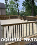 Upgrade Your Deck Game With These Rock Solid 26 Inch Hollow Round Aluminum Balusters In A Slick Matte Black Finish Easy Rack And Stack Setup For Railing Projects Tough Powder Coat Kills Rust Cold For Badass Outdoor Vibes installed on a modern wooden deck railing.