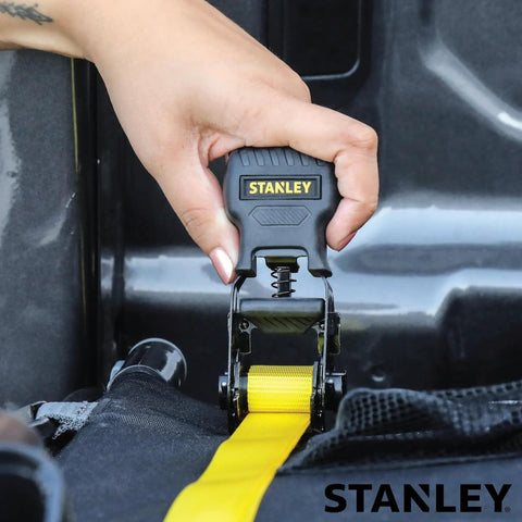 One Inch X Twelve Foot Ratchet Straps Four Pack Featuring Ergonomic Padded Grips and Heavy Duty Black Steel Clamps being operated securely.
