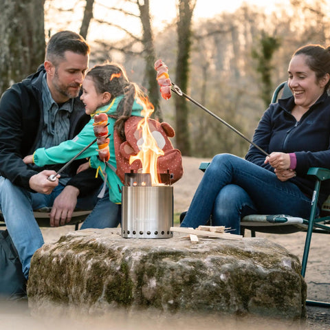 Family cooking over Pellet Adapter For Outdoor Camp Stoves Turns Your Campfire Into A Pellet Fueled Smokeless Safe Burn Stainless Steel 6.1 Inch Diameter Extension