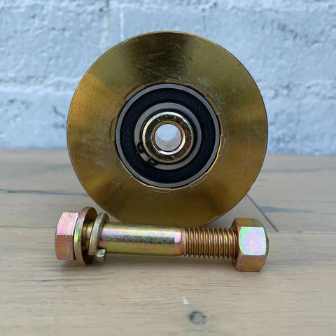 Heavy Duty 4 Inch Solid Steel V Groove Gate Wheels 2500 Pounds Capacity Sliding Gate Rollers with smooth dual bearings close-up.
