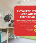 Wall-mounted 3/8 Inch By 50 Foot Air Hose Reel With Heavy Duty Industrial Build And Flex Hybrid Polymer Hose in a workshop.