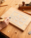 Heavy Duty Acrylic Heart Router Template For Practical Woodworking And Charcuterie Boards Features Twelve Cut Sizes Providing Flawless Trimming Lines That Make Custom Inlay Work No Sweat And Straight Fire used on wood.