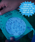 Person holding star wheel from Kid Friendly Telescope And Astronomy Kit With 25X And 50X Magnification, Adjustable 48 Inch Tripod.