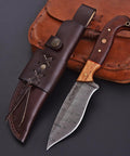 Custom Handmade Damascus Fixed Blade Knife 10 Inch With Rosewood And Olive Wood Handle on black surface with leather sheath