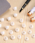 SEIWEI 20 Pack Insulating Pen Bushings Non Stick For CA Finish, 14x11mm 60 Degree Cone Shape Taper on wood desk with pens