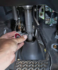 Using Three Eighths Inch Drive 72 Tooth Gimbal Ratchet in tight automotive space, showing hand positioning on fastener.