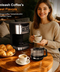 Woman enjoying coffee next to a Programmable 12 Cup Coffee Maker With Keep Warm Function, Fully Automatic Drip Coffee Machine, Stainless Steel Finish.