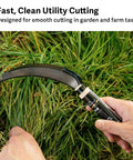Hands using Workhorse Harvest Sickle And Saw Sickle Hand Tool For Veggie Harvesting, Rope Cutting, And Field Work in garden