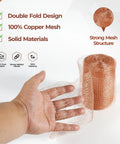 Copper Mesh Rodent Control Roll 5In By 36Ft Rustproof Copper For Blocking Holes In Garden with hand showing mesh flexibility.