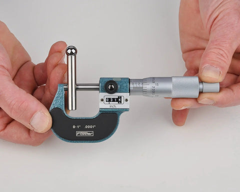 Person holding Premium Digit Outside Micrometer 0 To 1 Inch, 0.0001 Inch Readings, 0.256 Inch Flat Anvil Spindle for accurate measurements