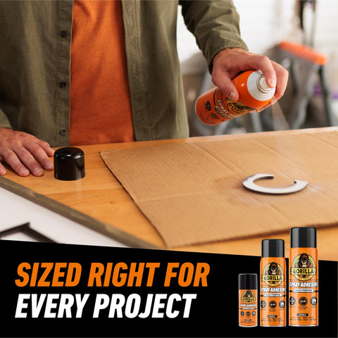 Person using Heavy Duty Spray Adhesive Clear Glue 14 Oz All Purpose Bond For Glass Plastic Wood Metal Ceramic Rubber Leather Paper