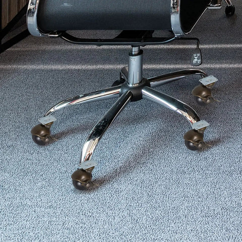 Four 4 Inch Antique Bronze Swivel Casters With Locking Brake For Heavy Duty Tables Chair Legs providing smooth glide under an office chair.