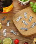 40 Pack Manual Stainless Steel Can Openers for Camping and Travel displayed on a wooden board and table