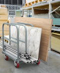 Beast 2 In 1 Drywall Cart Heavy Duty Platform Cart with steel frame in warehouse, loaded with panels and pipes.