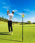 Golfer swings on course with All In One Golf Swing Selfie Stick With Ground Spike And Tripod, Magnetic Phone Holder recording.