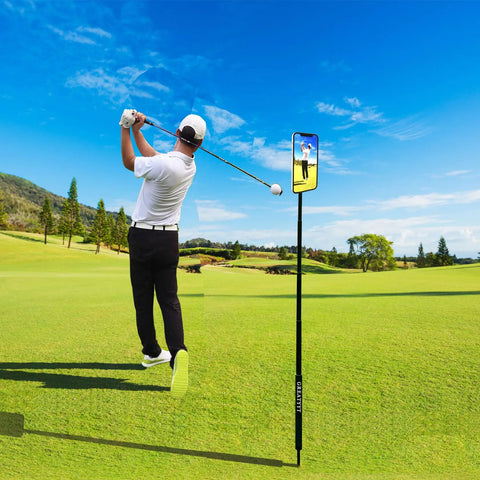 Golfer swings on course with All In One Golf Swing Selfie Stick With Ground Spike And Tripod, Magnetic Phone Holder recording.