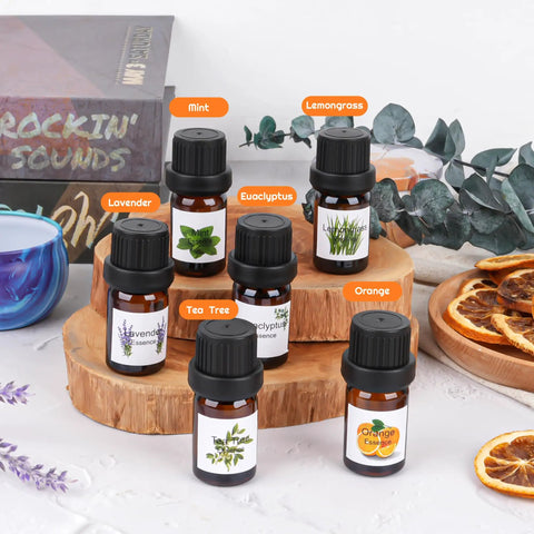 All In One DIY Candle Making Kit for Adults With Beeswax Essential Oils Dyes Wicks And Tins No Fuss Beginner Friendly Craft Gift Set For Holidays And Home Scent Creations showcasing six essential oil bottles labeled mint, lemongrass, lavender, eucalyptus, tea tree, and orange on a wooden stand.