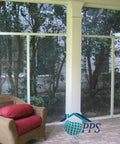 Heavy Duty 9 X 100 Foot Charcoal Fiberglass Mesh Screen With 20x20 No See Um Build used in a screened-in lanai with comfy red cushions.