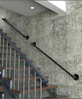 Sleek Black Wrought Iron Stair Rails With Super Grippy Non Slip Coating Zero Hassle Diy Wall Mount Setup Heavy Duty Indoor Outdoor Banister For Seniors Kids Hallway Loft And Bathroom 19 Feet Long mounted on a wall by stairs.