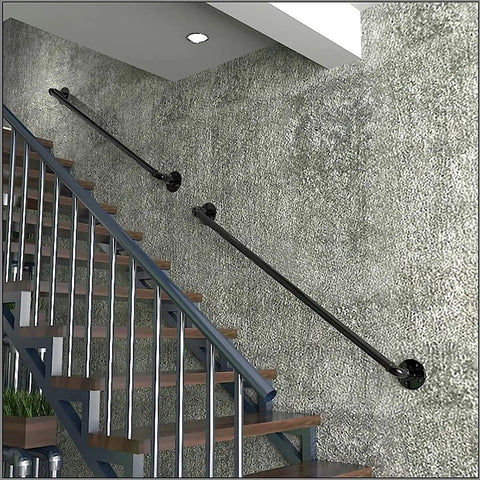 Sleek Black Wrought Iron Stair Rails With Super Grippy Non Slip Coating Zero Hassle Diy Wall Mount Setup Heavy Duty Indoor Outdoor Banister For Seniors Kids Hallway Loft And Bathroom 19 Feet Long mounted on a wall by stairs.