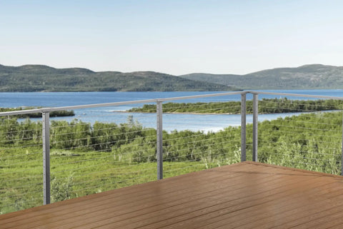 This 12 Foot Cable Railing Kit Brings Serious Style To Any Deck Or Patio Featuring Pre Drilled Metal Posts Marine Grade Stainless Wire All Necessary Tools And Hardware In Smooth Grey With A No Fuss Face Mount Assembly overlooking a scenic lake.