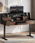 Built Tough 55 Inch Electric Adjustable Standing Desk Featuring Five Roomy Storage Drawers And Raised Monitor Platform Smooth Glide Motor Custom Memory Buttons Boss Home Office Setup with an open drawer and monitor.