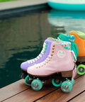 Pink and orange quad skates with Outdoor Roller Skate Wheels 38mm By 62mm 80A Turquoise 4 Pack Durable Urethane by poolside.