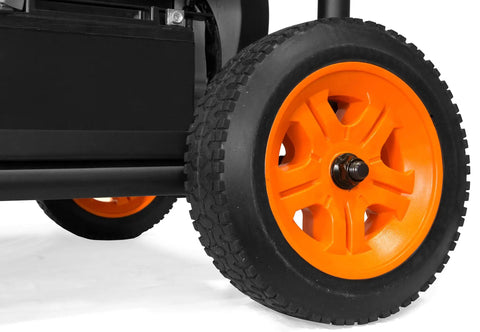 Close-up of Heavy Duty 4750 Watt Portable Generator With Electric Start and Wheel Kit showing durable orange wheel tread.