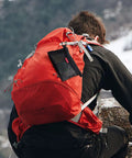 Black Grab-And-Go Water-Resistant Zipper Pouch Set Mesh Storage Bags attached to orange backpack on hiker