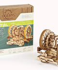 Build A Legit Working Vehicle Differential System With This Hands On Wooden Model Kit showing assembled wooden differential model next to its box.