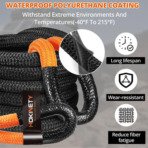 Black Kinetic Recovery Tow Rope 1.26 Inch By 30 Foot Snatch Strap shown coiled with soft shackles for offroad towing