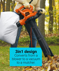 Person using 3 In 1 Corded Leaf Blower Vacuum Mulcher With 230 MPH Airflow And 12 Amp Motor in vacuum mode outdoors