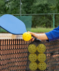 Person holding Outdoor Pickleball Balls With 40 Holes For Superior Durability And Stability, Seamless Design For Repeated Hits, High Visibility