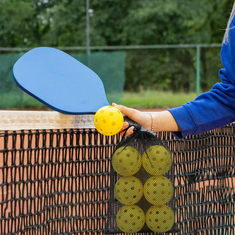 Person holding Outdoor Pickleball Balls With 40 Holes For Superior Durability And Stability, Seamless Design For Repeated Hits, High Visibility