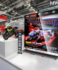 Hella Crisp 80 Inch Led Digital Signage Display Ready To Roll With Foldable Seamless Stitch Panels And Sleek P1.86 Gob Screen Module Turnkey Commercial Advertising Kiosk With Hard Flight Case For Events Or Weddings Black Pair in a trade show setting with motorcycles.