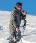 Man using Push To Talk Handheld And Wearable Speaker Microphone Set For GMRS Radios, 4 Pack in snowy landscape