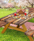 Rustic wood picnic table with plaid decor in a park