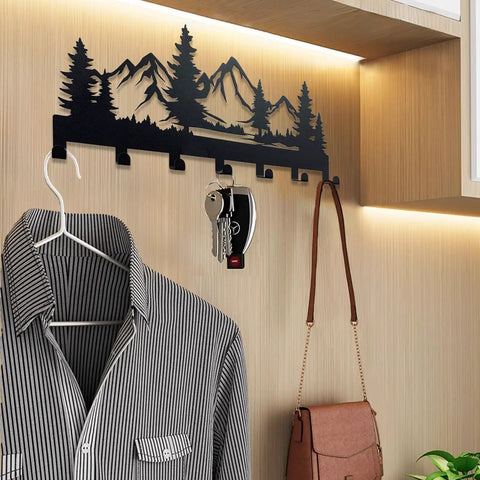 Wall-mounted Slick Heavy Duty Metal Key Holder with seven hooks, black finish, installed in entryway, holding keys and accessories