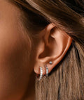 Stainless Steel Earring Set For Women, 10 Pairs, Includes Small Huggie Hoops, CZ Studs, And Glossy Spherical Studs on ear