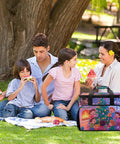 Family enjoying picnic by a tree with Insulated Picnic Backpack Cooler With 30L Capacity on blanket, scene of people sharing food.