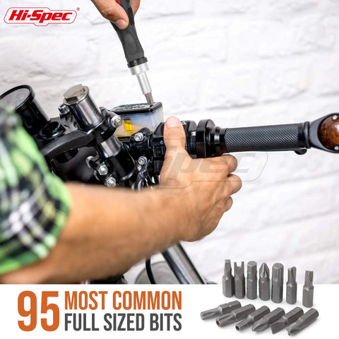 Person using 101 Pc Multi Bit Screwdriver And Ratcheting Handle Tool Set Kit With Quarter Inch Hex Bits for motorcycle repair