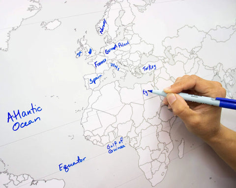 Hand writing on Massive Laminated World Outline Map Poster 36 By 24 Inches With Free Dry Erase Marker, Ideal For Classrooms Or Home Study