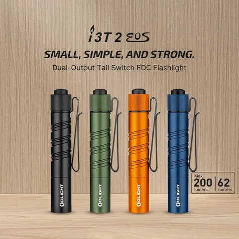 I3T 2 EOS Pocket EDC Flashlight in black, green, orange, and blue with 200 lumen output, dual tail switch, on wooden background.