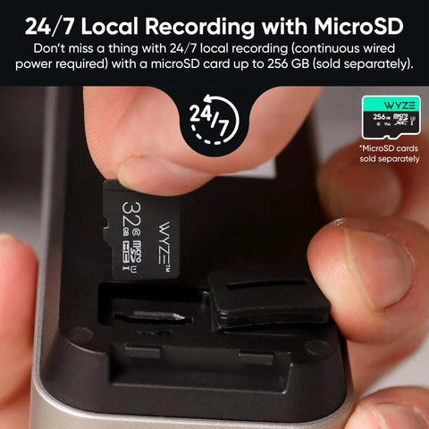 Person inserting microSD card into Battery Video Doorbell Wireless Camera Cordless With 1 To 1 Head To Toe View And Color Night Vision 150 Degree Ultra Wide Field Of View 2 Way Audio Monitors People Vehicles Packages Wire Free Or Wired.